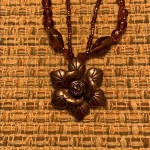 Rose gold tone & amber color necklace